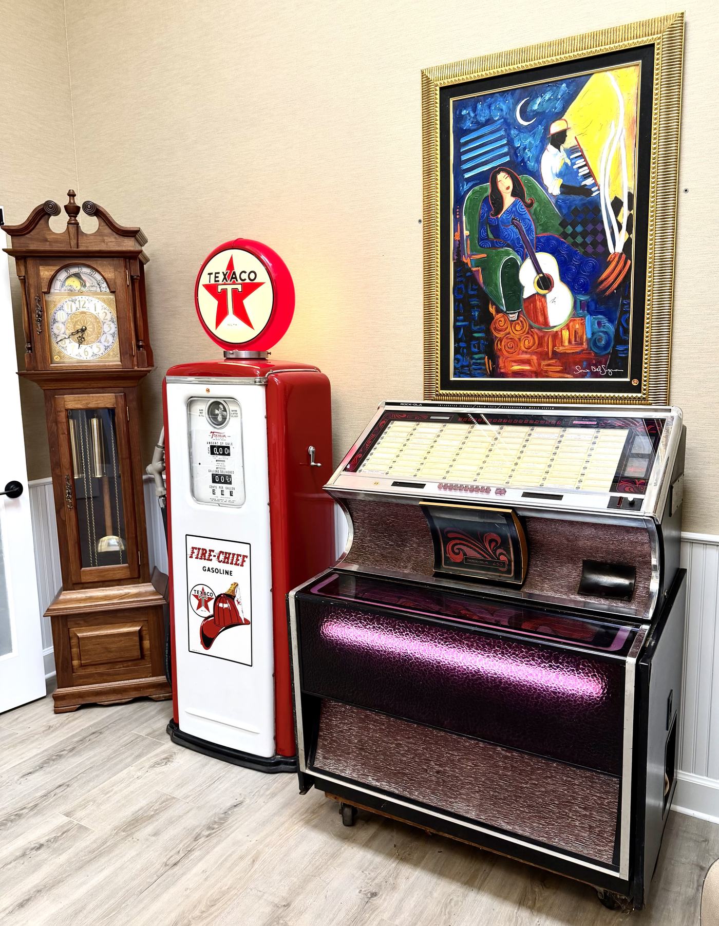 Antiques and collectibles at West Coast Auction Company, including a Texaco gas pump and jukebox