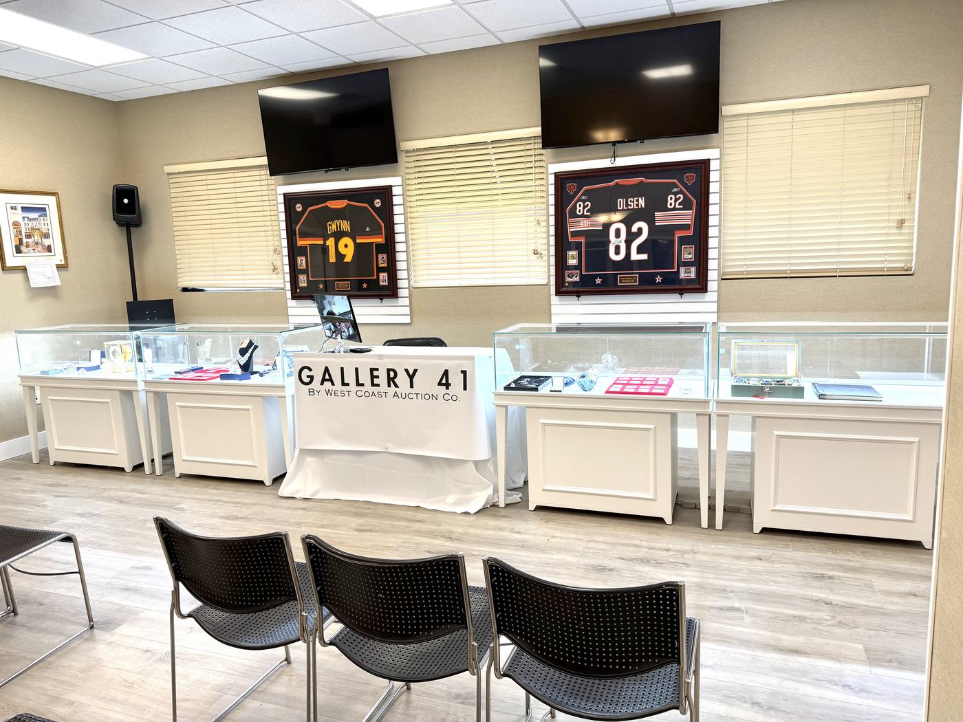 Inside the Gallery 41 showroom, with framed jerseys and glass display cases of collectibles